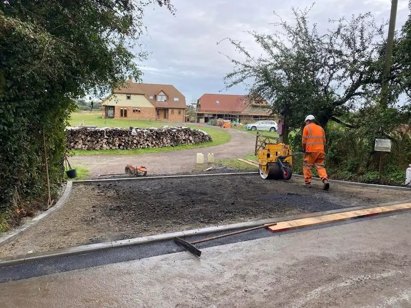 Ground work contractors in Kent preparing to install new tarmac driveway entrance.